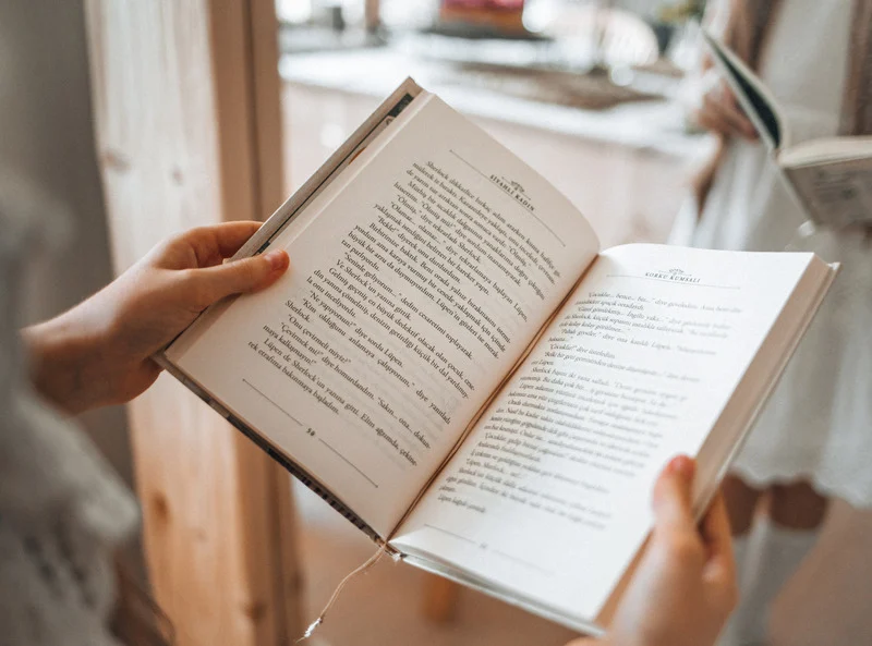 book opened in two hands